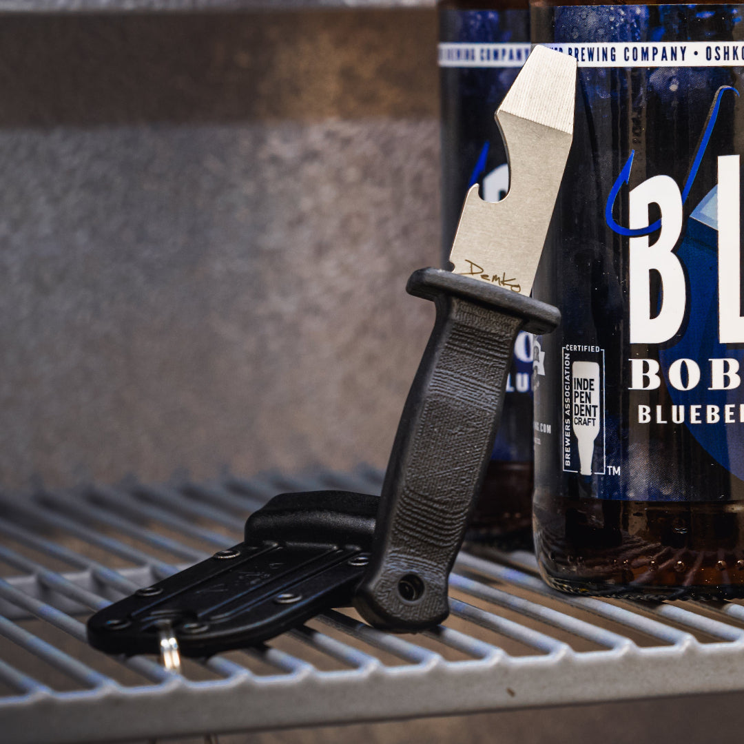 Armiger 2 leaning on a bottle sitting on a shelf.