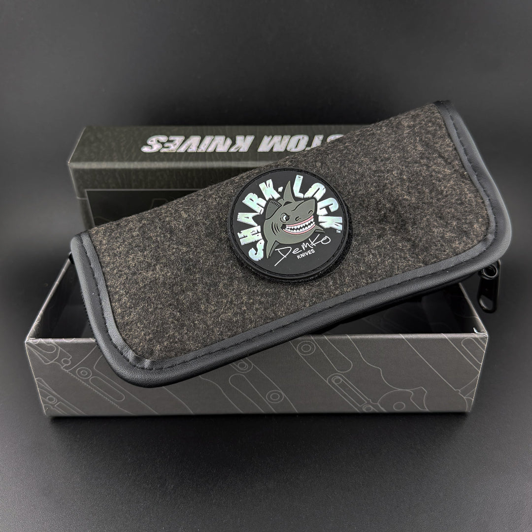 Demko gray pouch with shark-lock logo patch. Fits inside a two piece high end box with Demko branding.