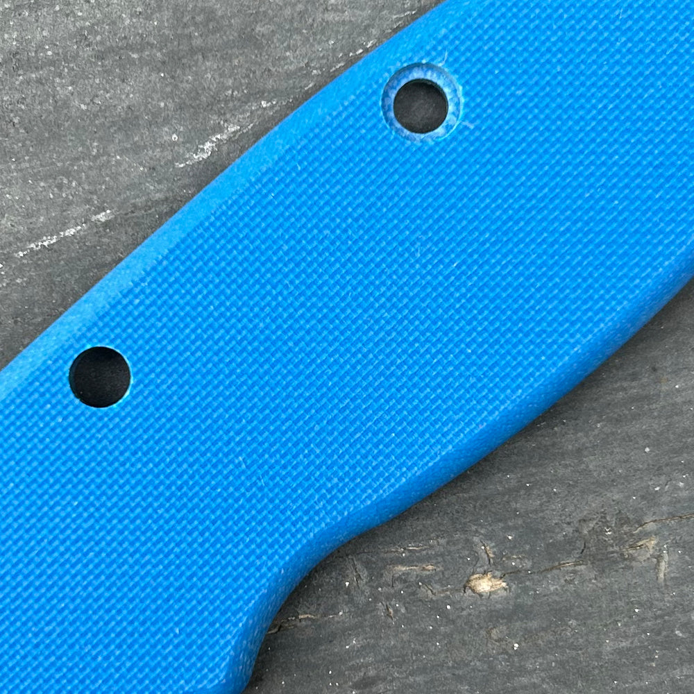 Close-up of blue peel ply texture G10 replacement scales for AD20 folding knife.