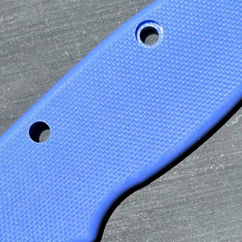 Close-up view of a blue2 G10 handle replacement scale with a peel ply texture pattern.