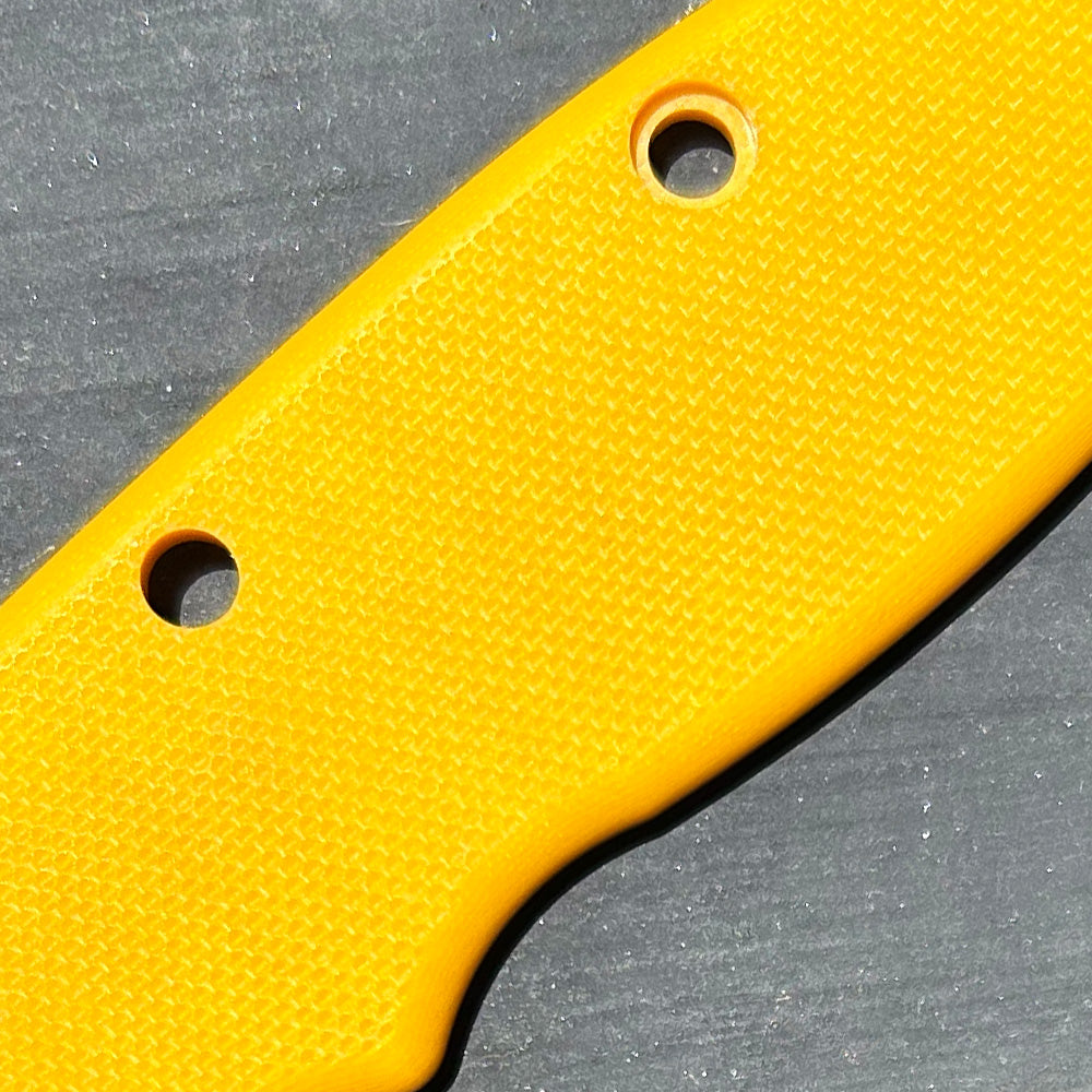 Close-up of yellow2 peel ply texture G10 replacement scales for AD20 folding knife.