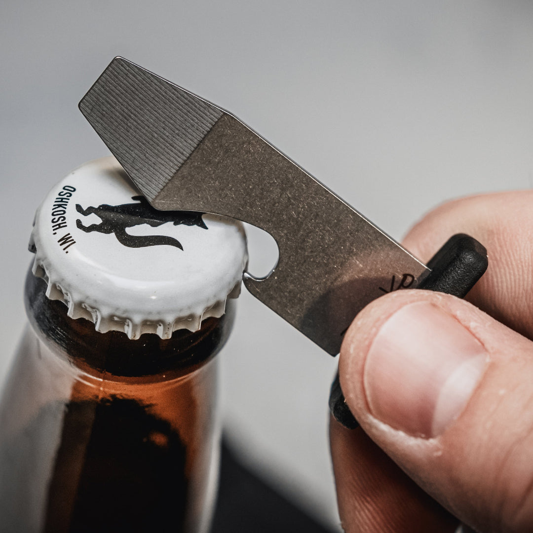 The Armiger 2 being used to open a bottle.