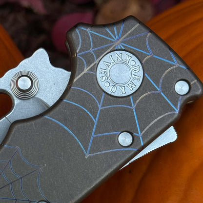 MGAD20 MagnaCut Clip Point Titanium Halloween 2025
