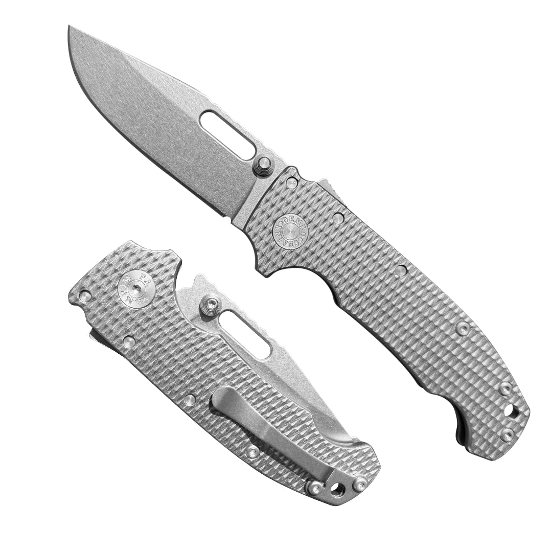 American made AD20 folding knife with MagnaCut drop point blade and Milled Titanium K1, canoe shaped handle.