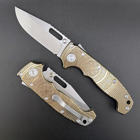 American made AD20S (Slim) folding knife with a laser etched titanium handle and a MagnaCut clip point blade.