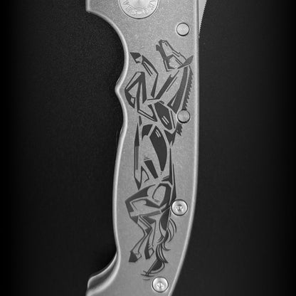 Close-up of the titanium handle scale with a laser etched design to commemorate the year of the horse.