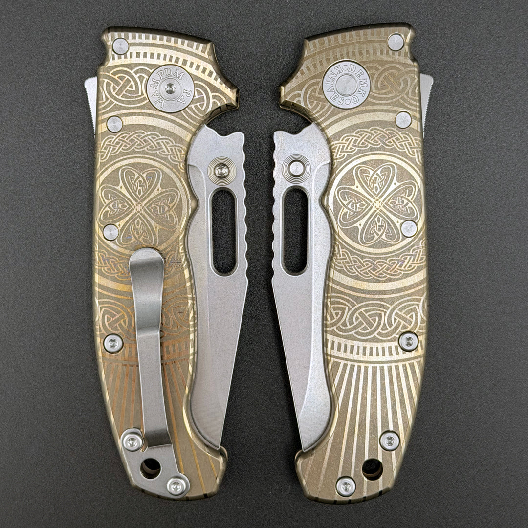 American made AD20S (Slim) closed folding knife with a laser etched titanium handle and a MagnaCut clip point blade.