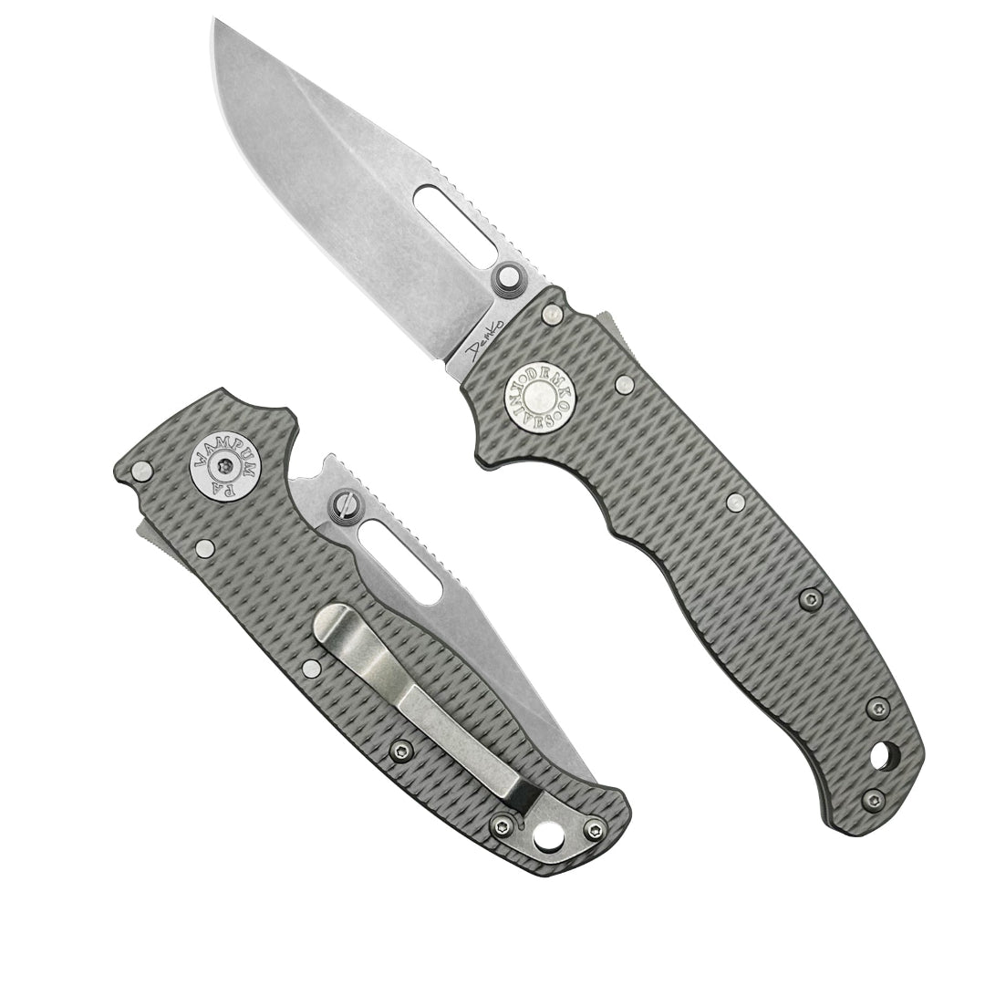 AD20.5 folding knife with a milled titanium handle and a CPM20CV steel clip point blade.
