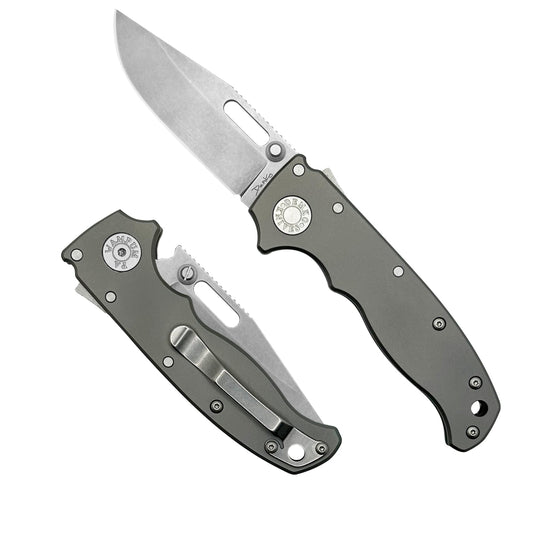 AD20.5 folding knife with a smooth titanium handle and a CPM20CV steel clip point blade.