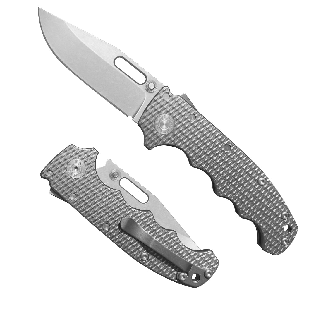 American made AD20S (Slim) folding knife with MagnaCut clip point blade and Milled Titanium full grip handle.