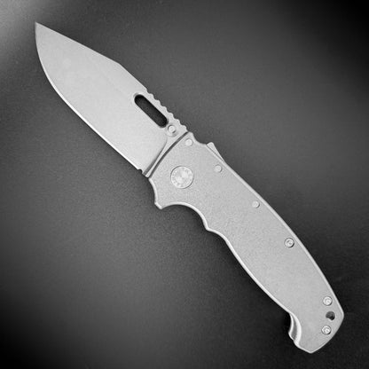 AD20 XXX 3V folding knife with slotted clip point blade and smooth titanium handle.