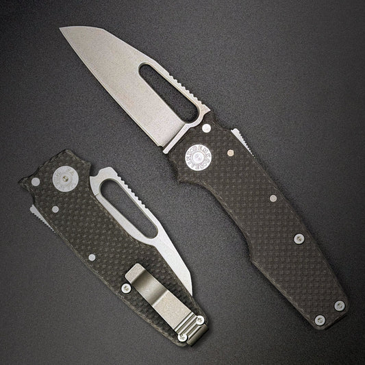 American made AD22 MagnaCut folding knife with carbon fiber handle on a dark gray background.