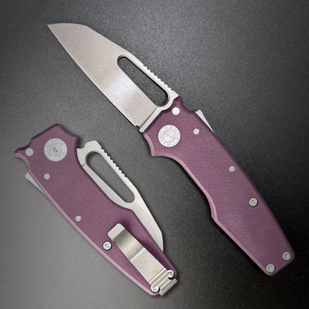 American made AD22 folding knife with a MagnaCut shark foot blade, purple G10 handle, new deep carry pocket clip and shark-lock mechanism.