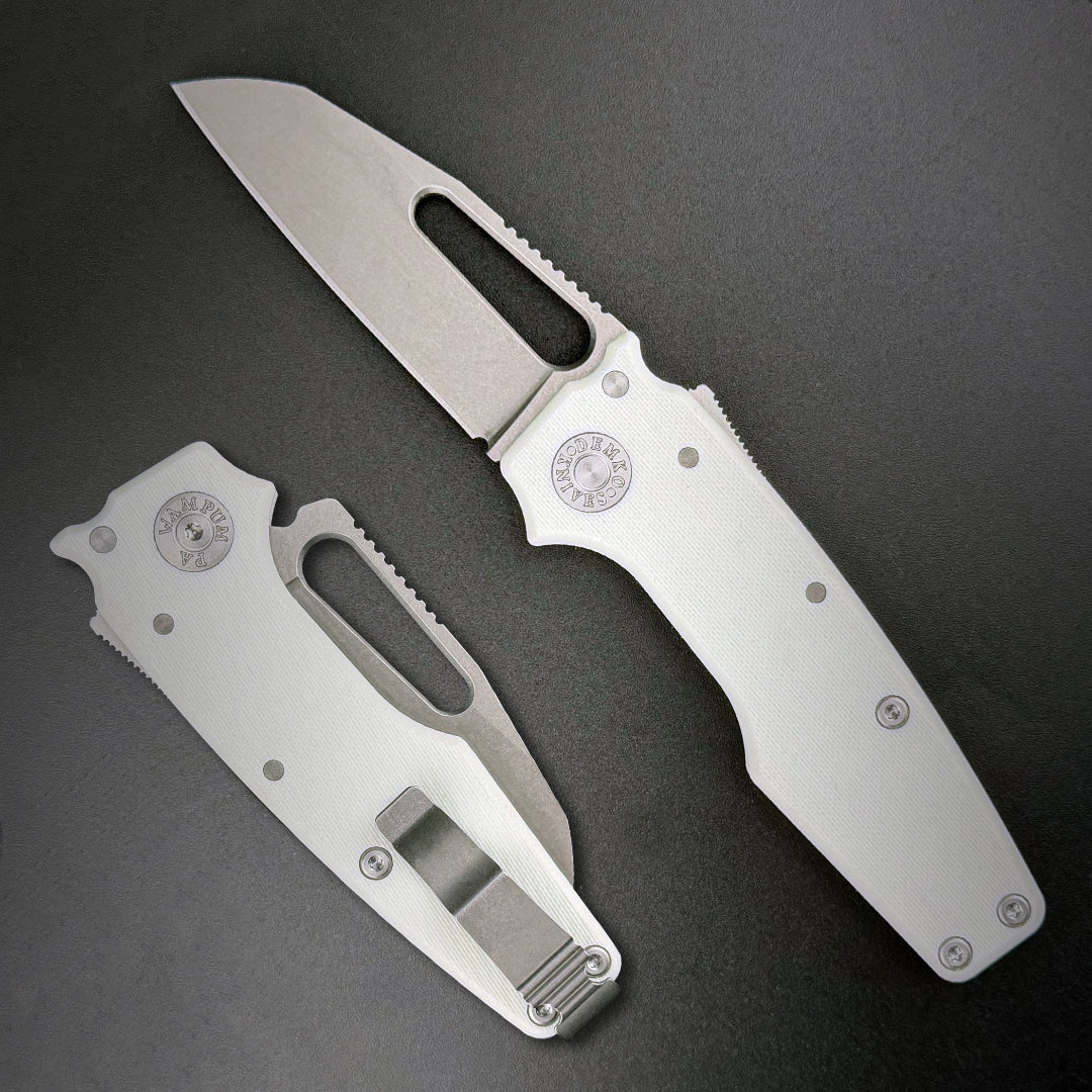 American made AD22 folding knife with a MagnaCut shark foot blade, white G10 handle, new deep carry pocket clip and shark-lock mechanism.