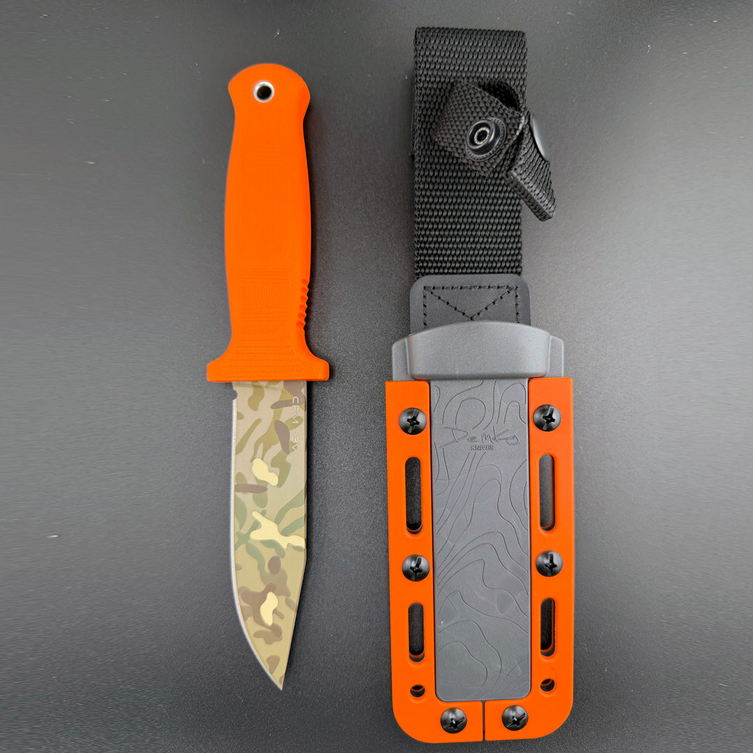 American made Armiger 4 orange knife with cerakote 7-color camouflage blade and sheath.