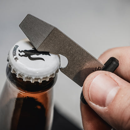 The Armiger 2 being used to open a bottle.