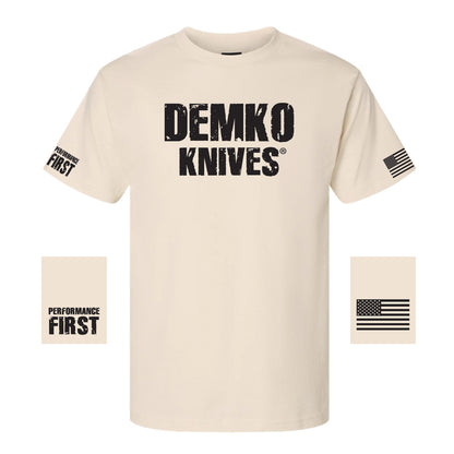 Beige t-shirt with 'Demko Knives' logo with "performance first" on one sleeve and the American flag on the other.