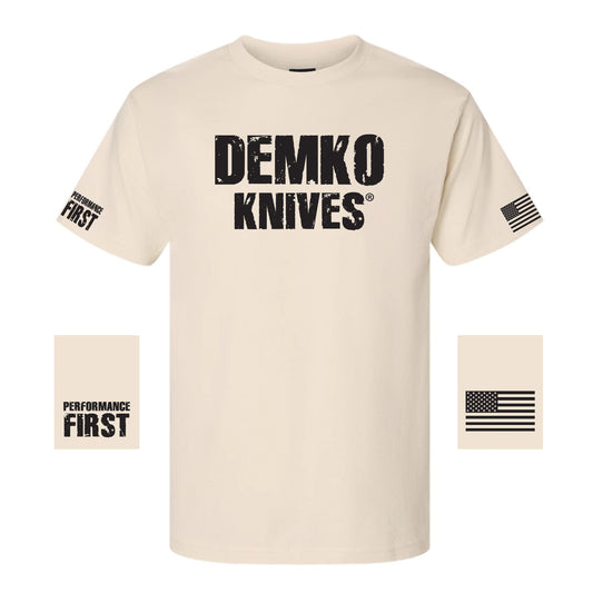 Beige t-shirt with 'Demko Knives' logo with "performance first" on one sleeve and the American flag on the other.