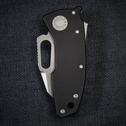 Nano-Shark folding knife with a 20CV Shark Foot blade on a dark textured background.