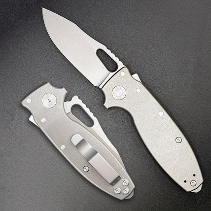American made Shark-A-Tac folding knife with a MagnaCut blade, integral soft touch carbide glass breaker, titanium handles and a deep carry pocket clip.
