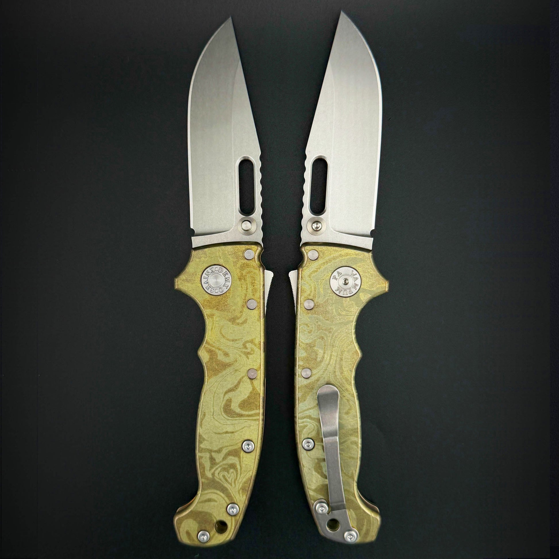 USA-Made AD20S clip point blade with  molten gold laser etched pattern on anodized titanium handle.