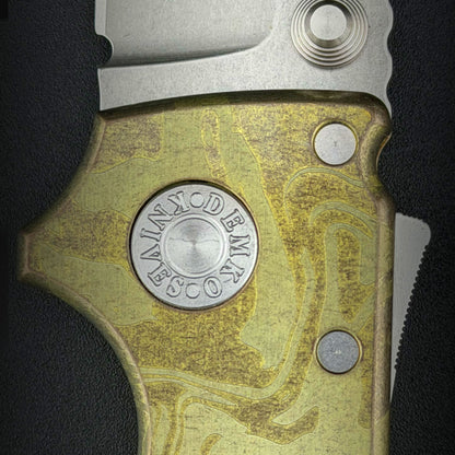 Close up view of the pivot pin. USA Made AD20S folding knife with titanium laser etched handle.