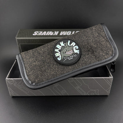 Demko gray pouch with shark-lock logo patch. Fits inside a two piece high end box with Demko branding.
