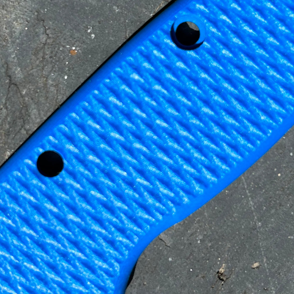 Close-up of blue milled texture G10 replacement scales for AD20 folding knife.