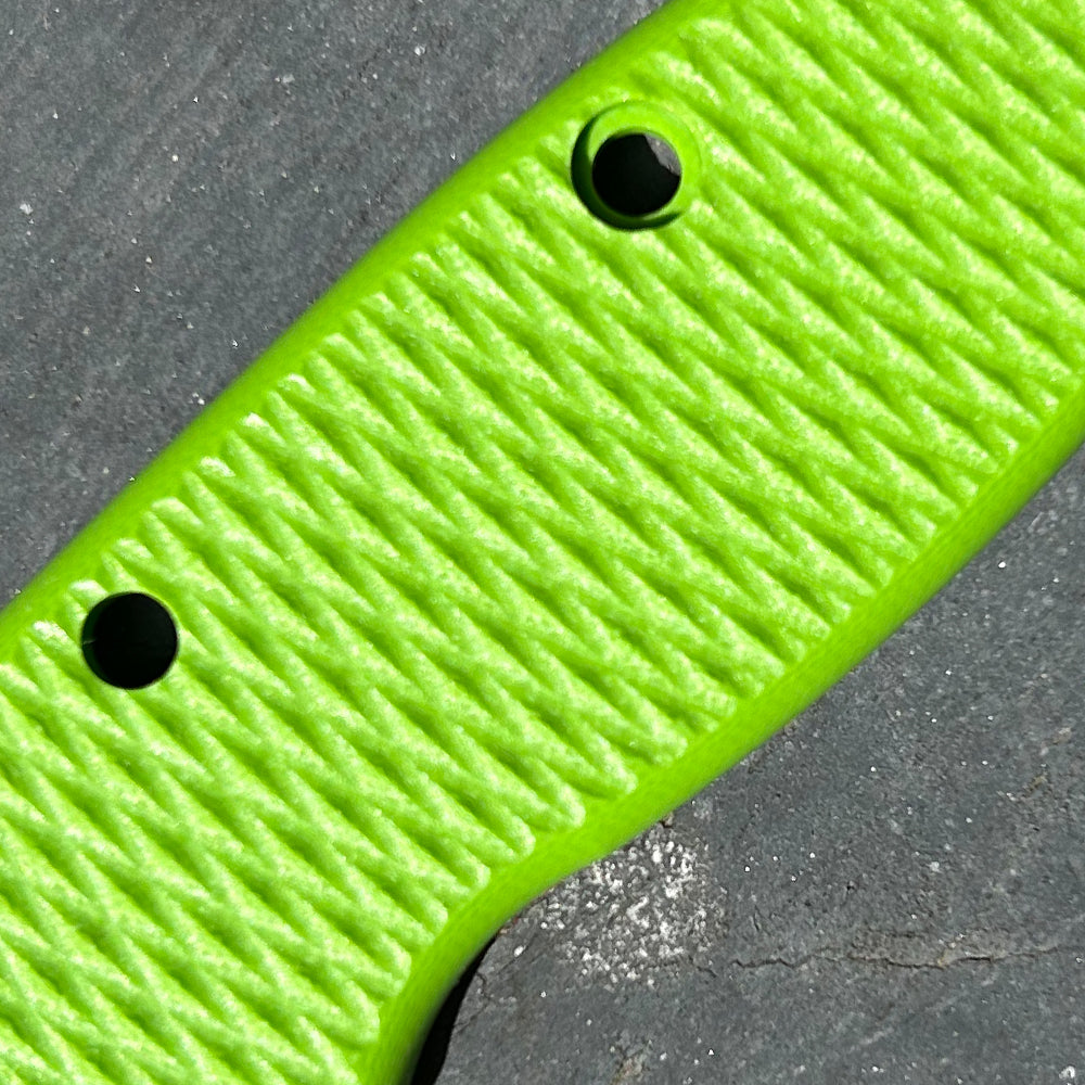 Close-up of green milled texture G10 replacement scales for AD20 folding knife.