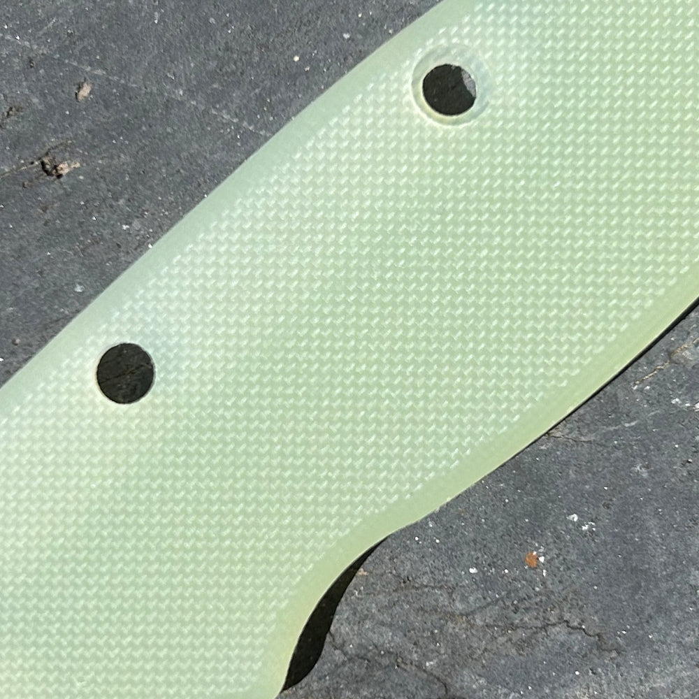 Close-up of natural texture peel ply G10 replacement scales for AD20 folding knife.