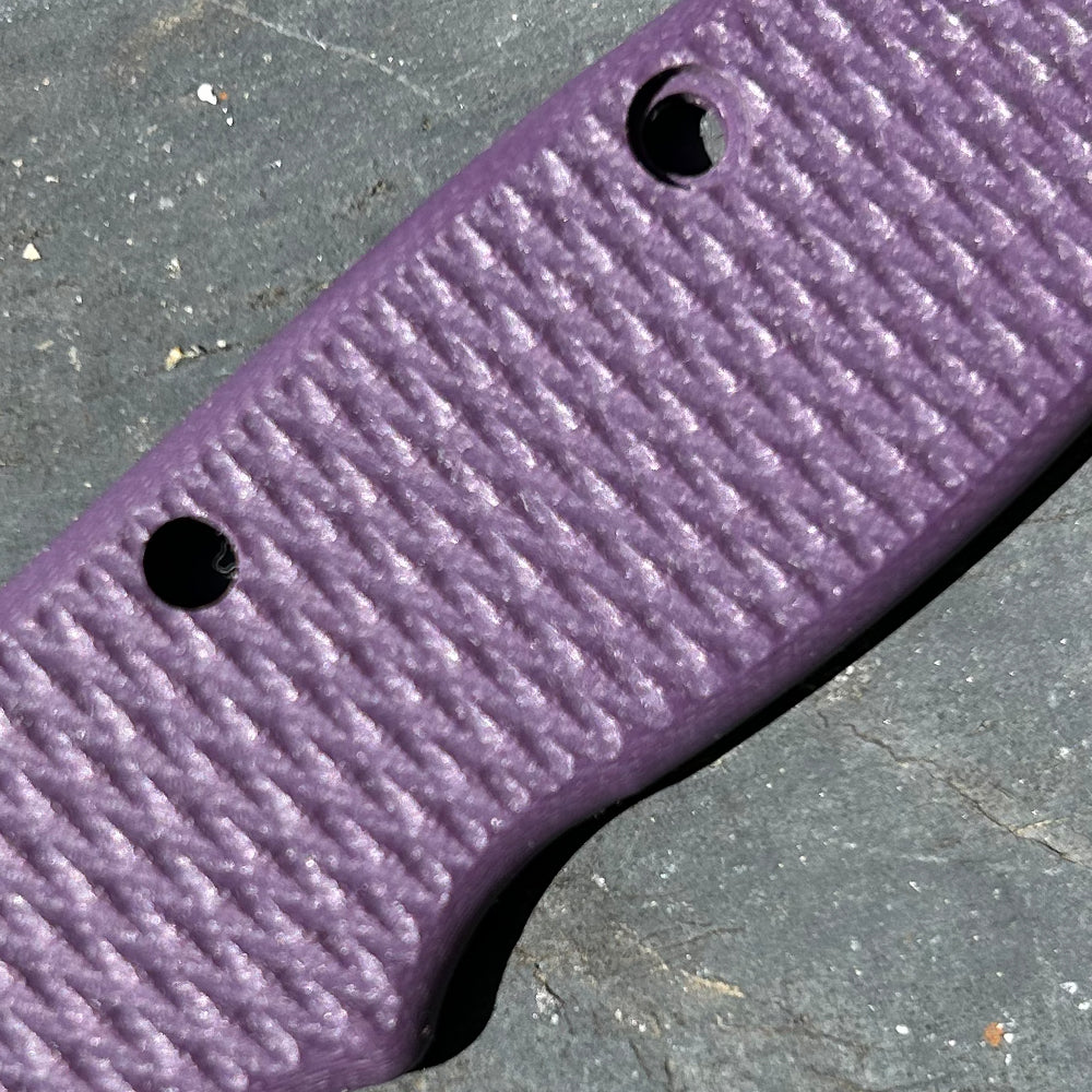 Close-up of purple milled texture G10 replacement scales for AD20 folding knife.