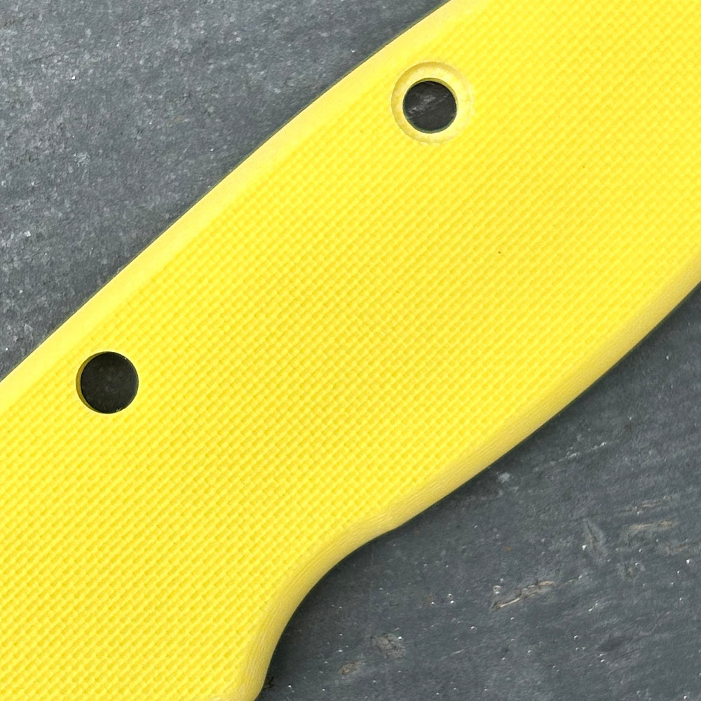 Close-up of yellow peel-ply texture G10 replacement scales for AD20 folding knife.